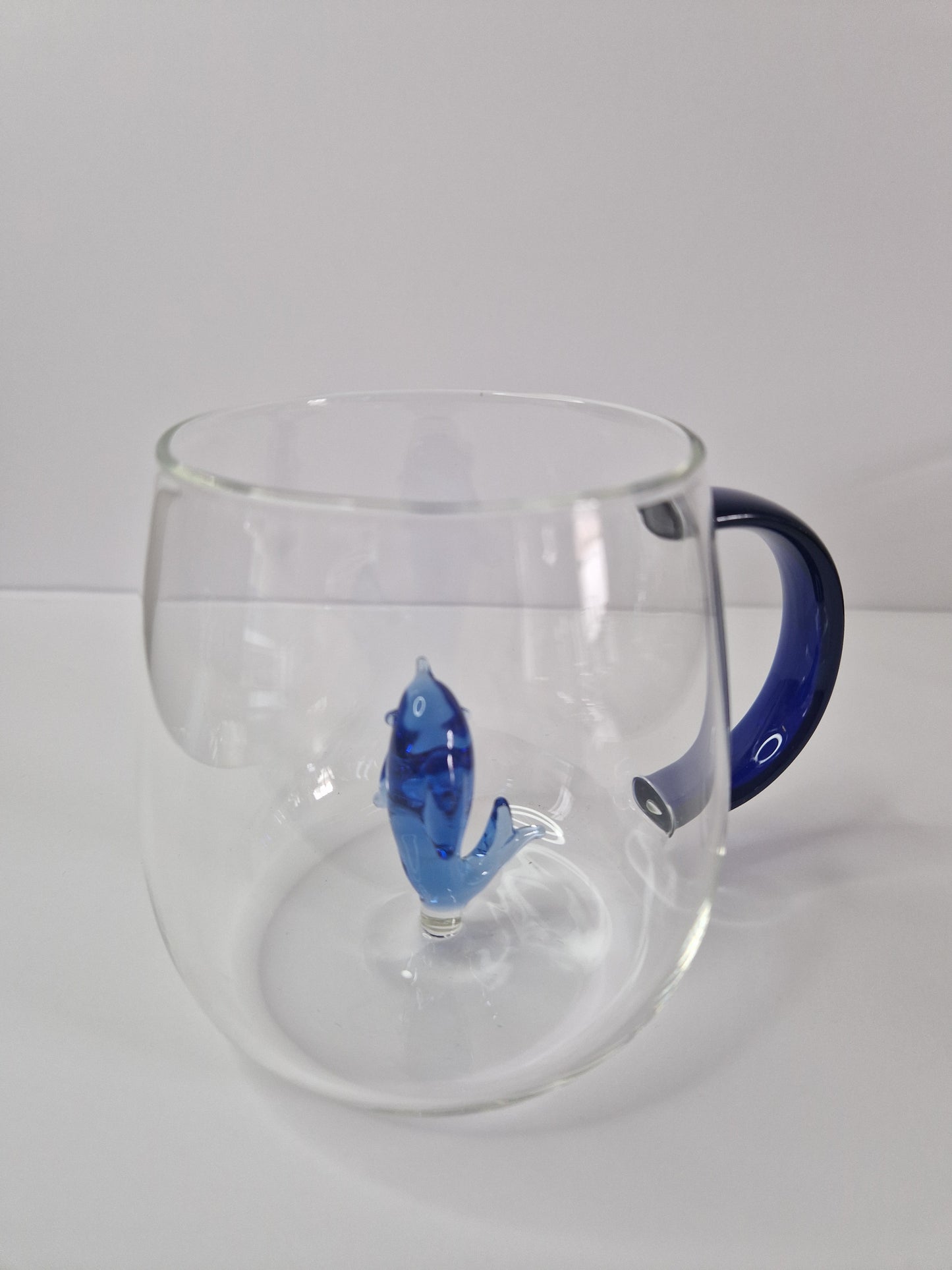 Glass coffee mugs with glass animals inside